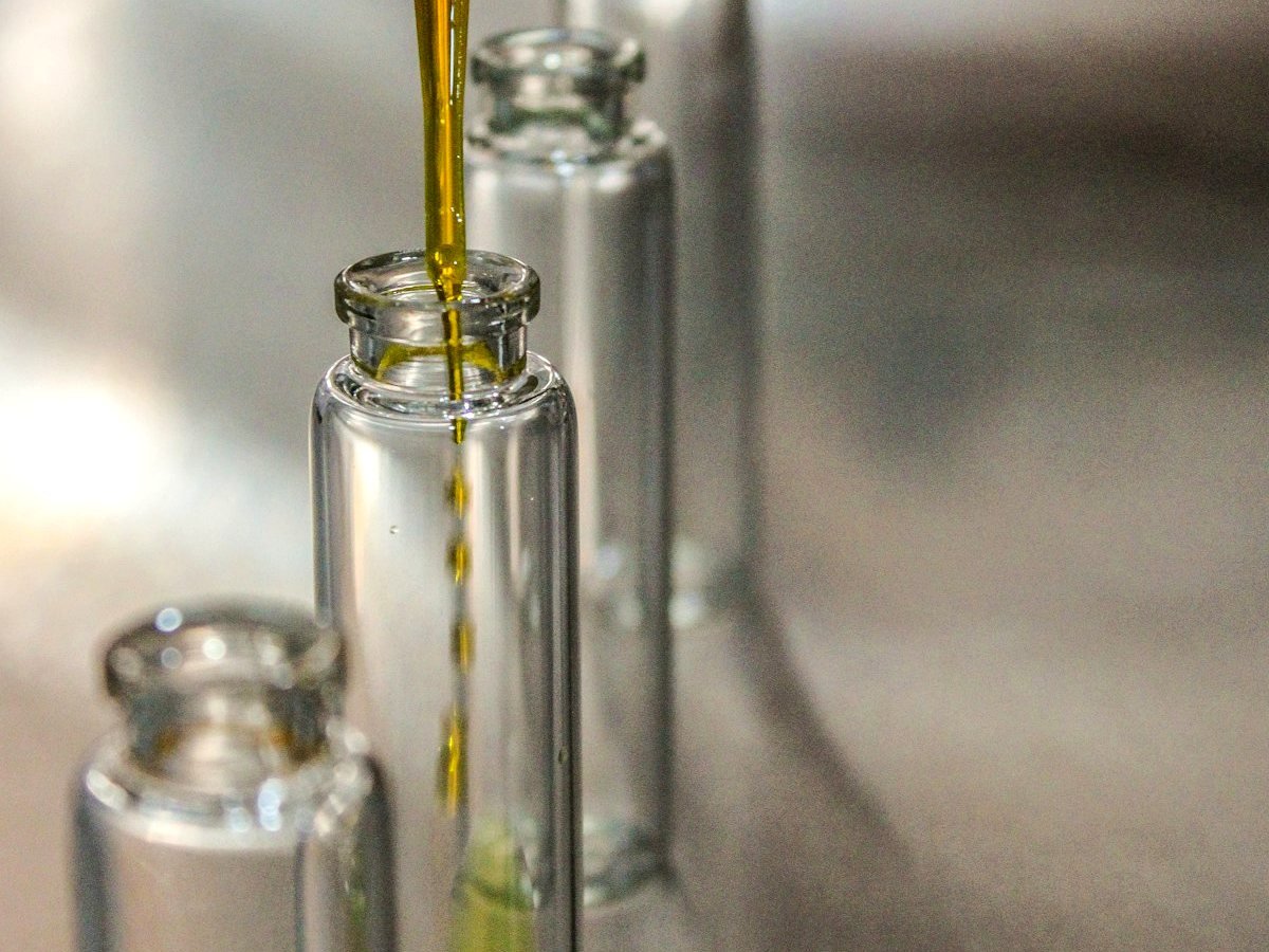 Perfume oil being filled into a bottle